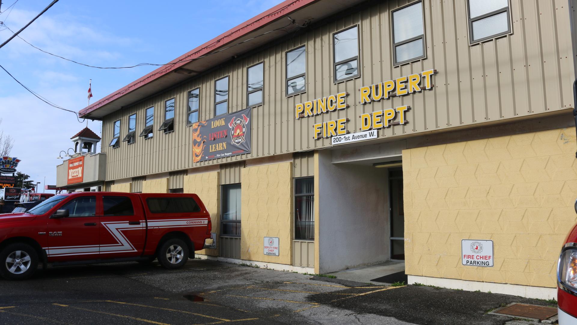 Image of tan building, photo taken outside Prince Rupert Fire Hall where 911 dispatch is located