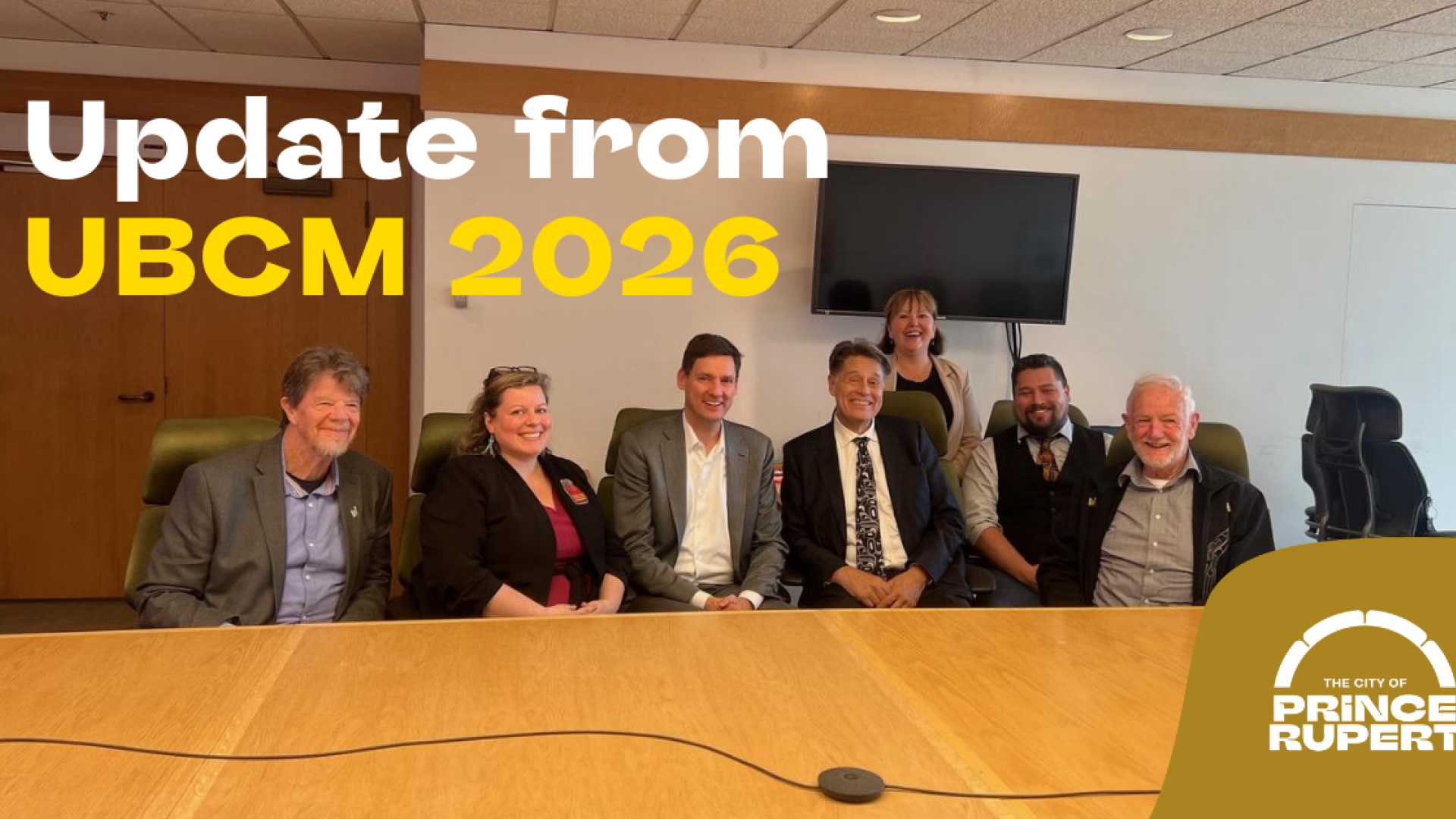 Councillors from the City of Prince Rupert sitting with Premier David Eby and MLA Tamara Davidson at a board table
